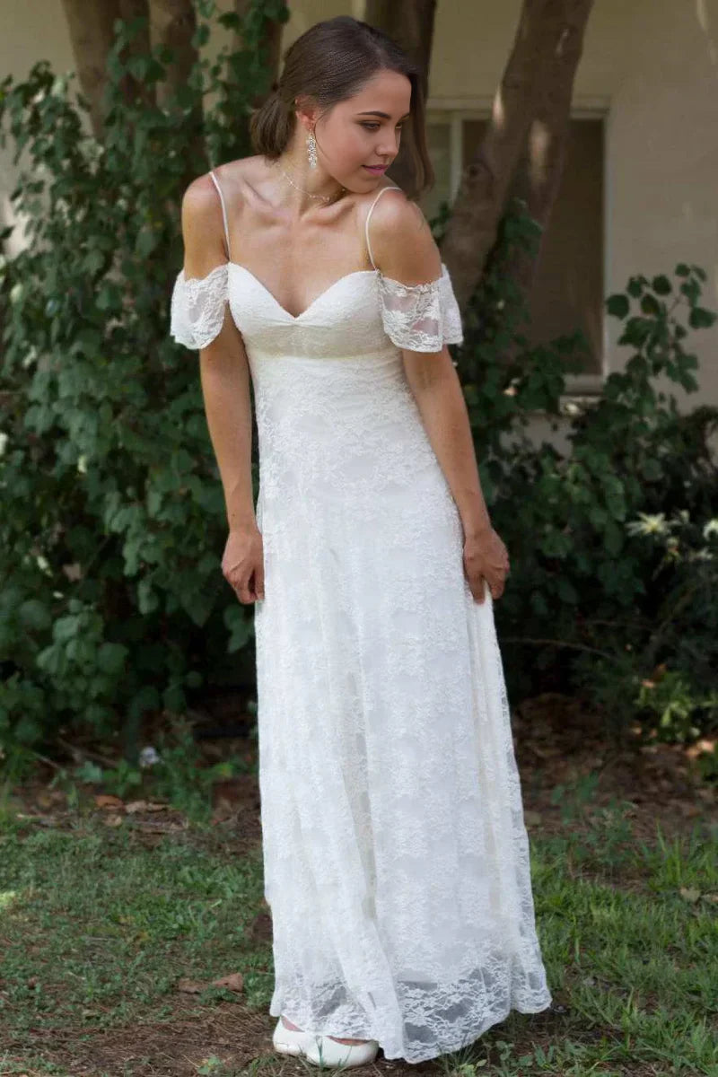 Vestido de novia de encaje con tirantes finos, hombros descubiertos y largo hasta el suelo